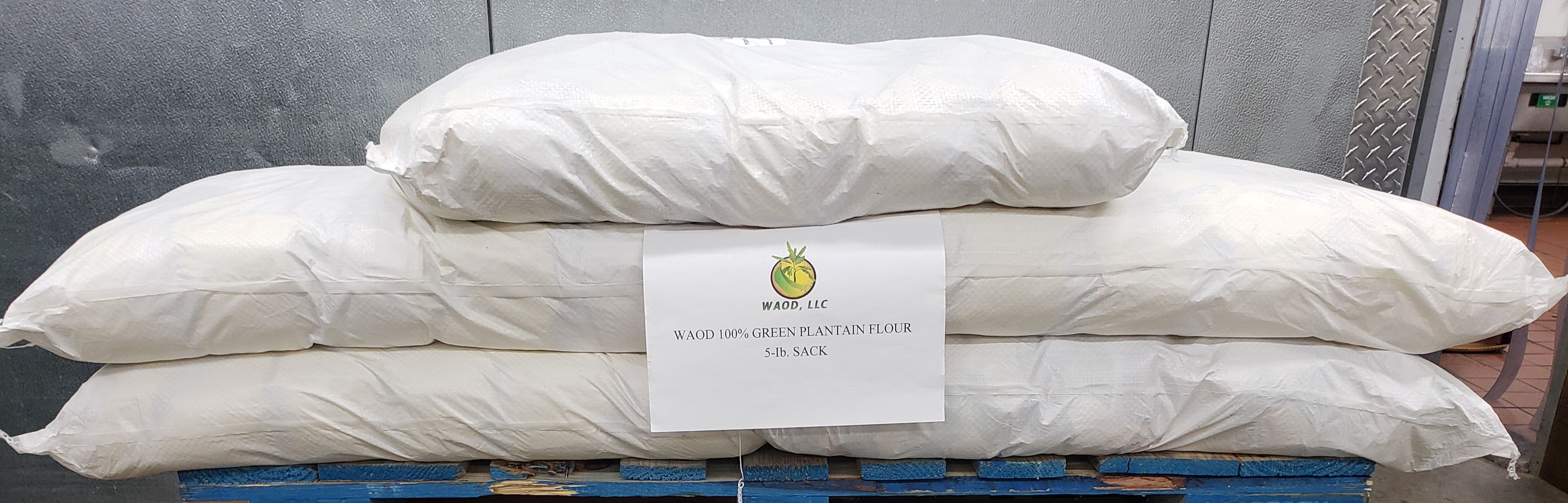 WAOD 100% Green Plantain Flour 5-lb sacks stacked on a pallet