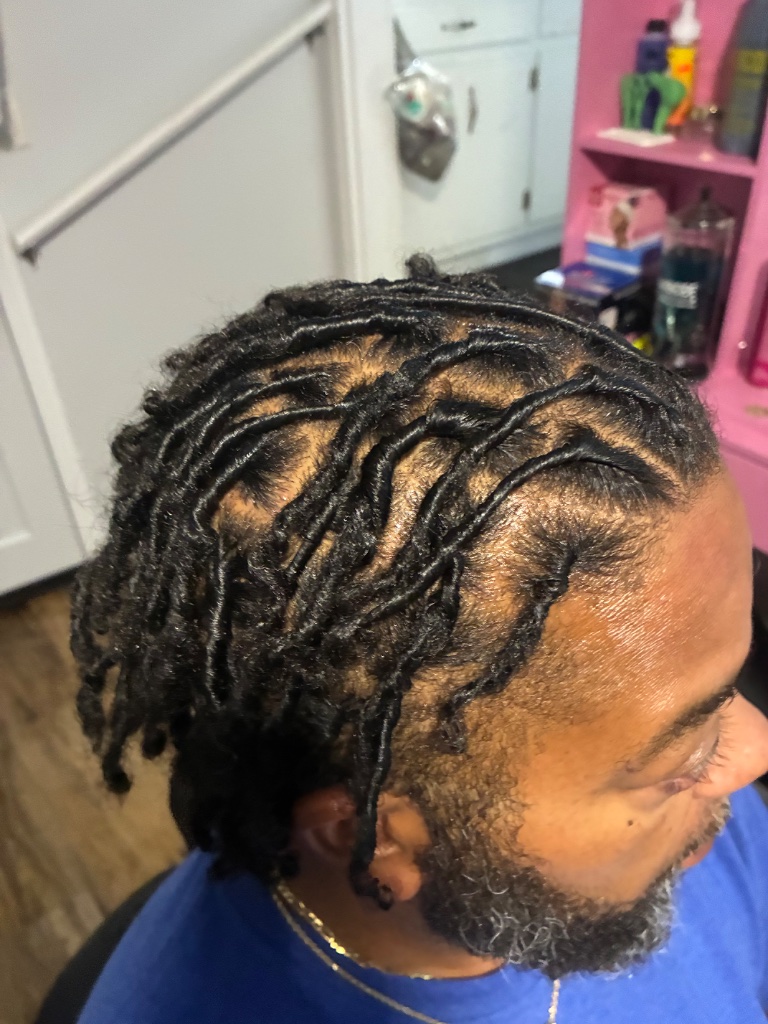 Fresh retwist on neatly sectioned locs