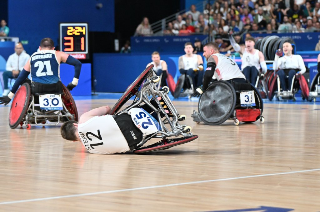 British wheelchair rugby player Stead No.12 falls to the floor during GBR vs FRA at Paris 2024