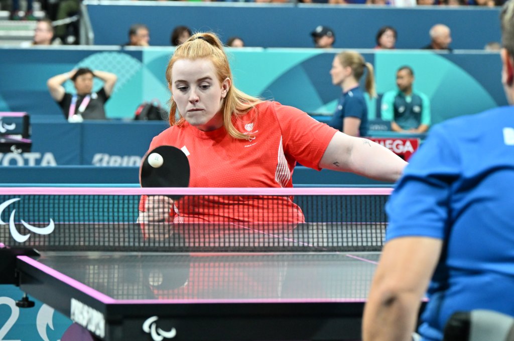 GB para table tennis athlete focused at the net, Paris 2024