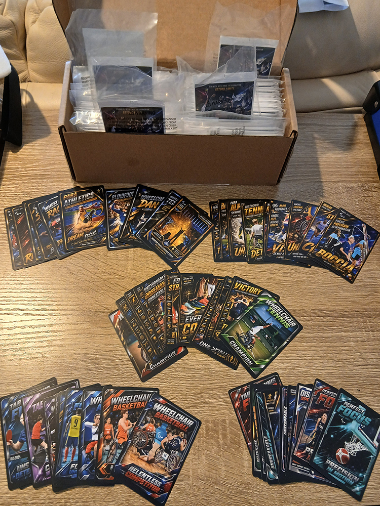 Disability Sports Trading Cards — freshly arrived collection spread on table