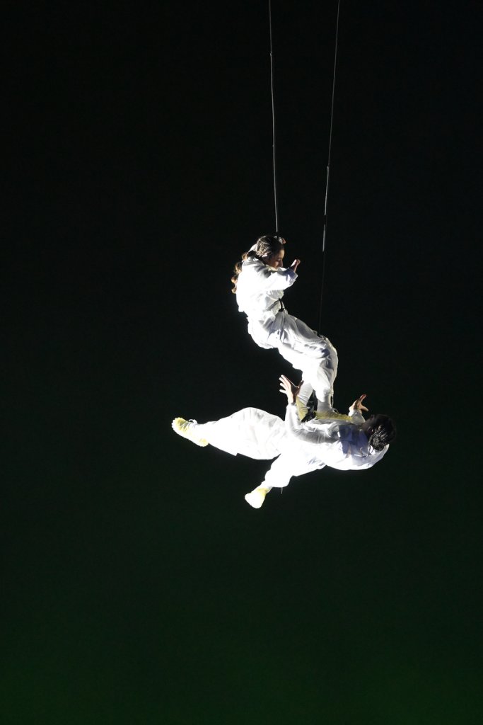 Aerial duo performing suspended by cables at the 2026 Winter Paralympics Opening Ceremony