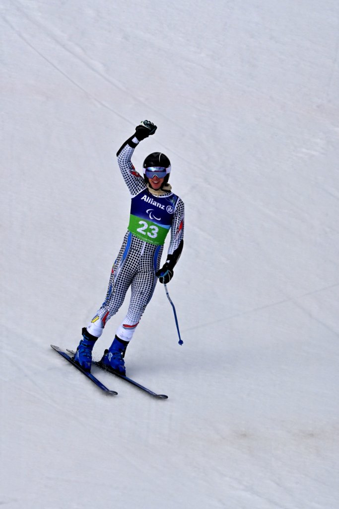Sit-ski athlete celebrates with raised fist at Milano Cortina 2026 Winter Paralympics