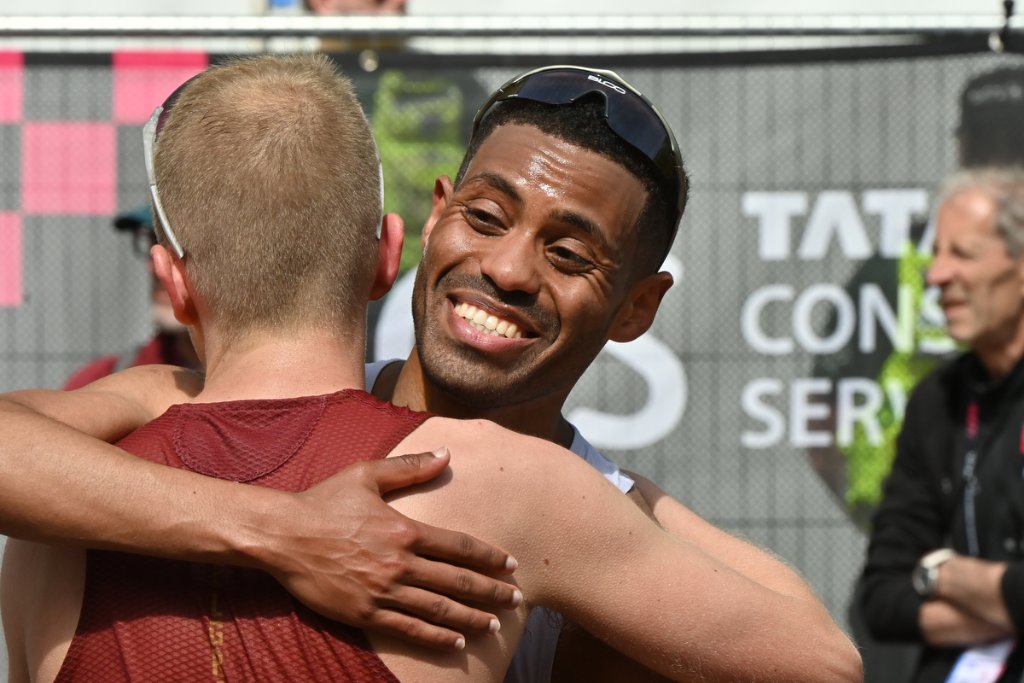 Two elite runners embracing at the finish of TCS London Marathon 2026