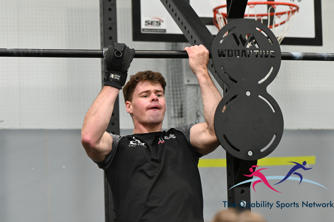Athlete performing a pull-up on the gym rig at Alt Movement