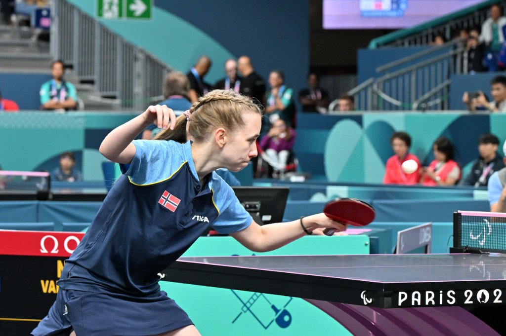 Norwegian para table tennis player reaching for a shot, Paris 2024