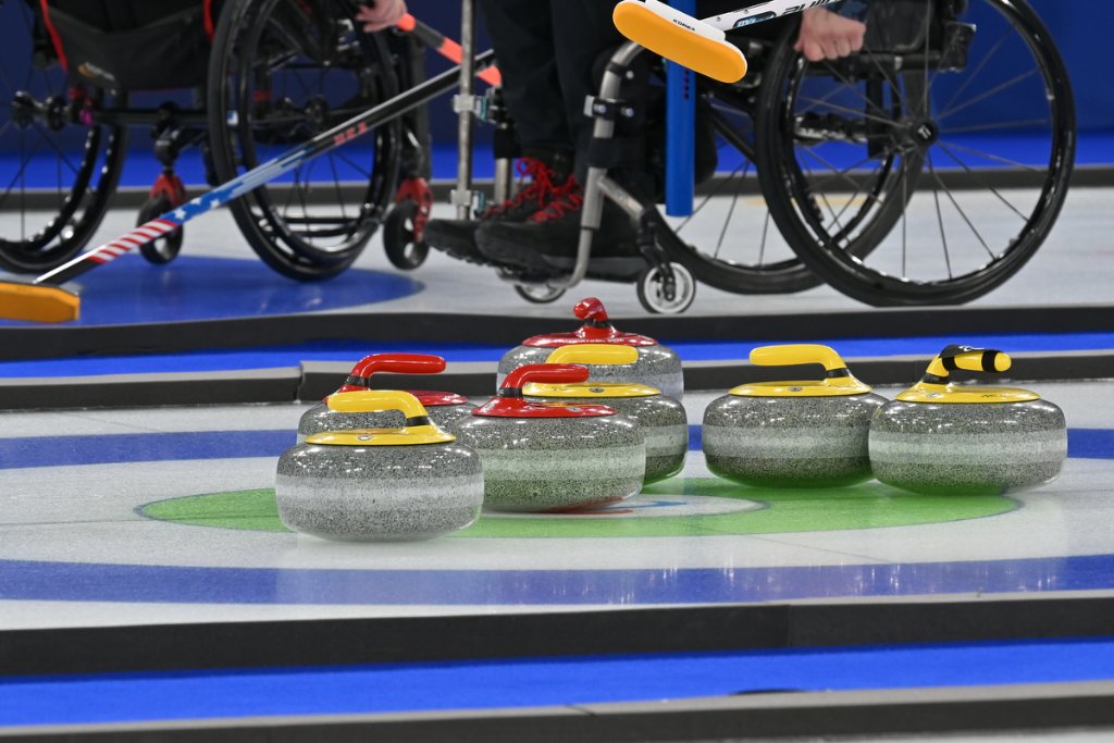 Focused wheelchair curler watching play during Milano Cortina 2026 Winter Paralympics