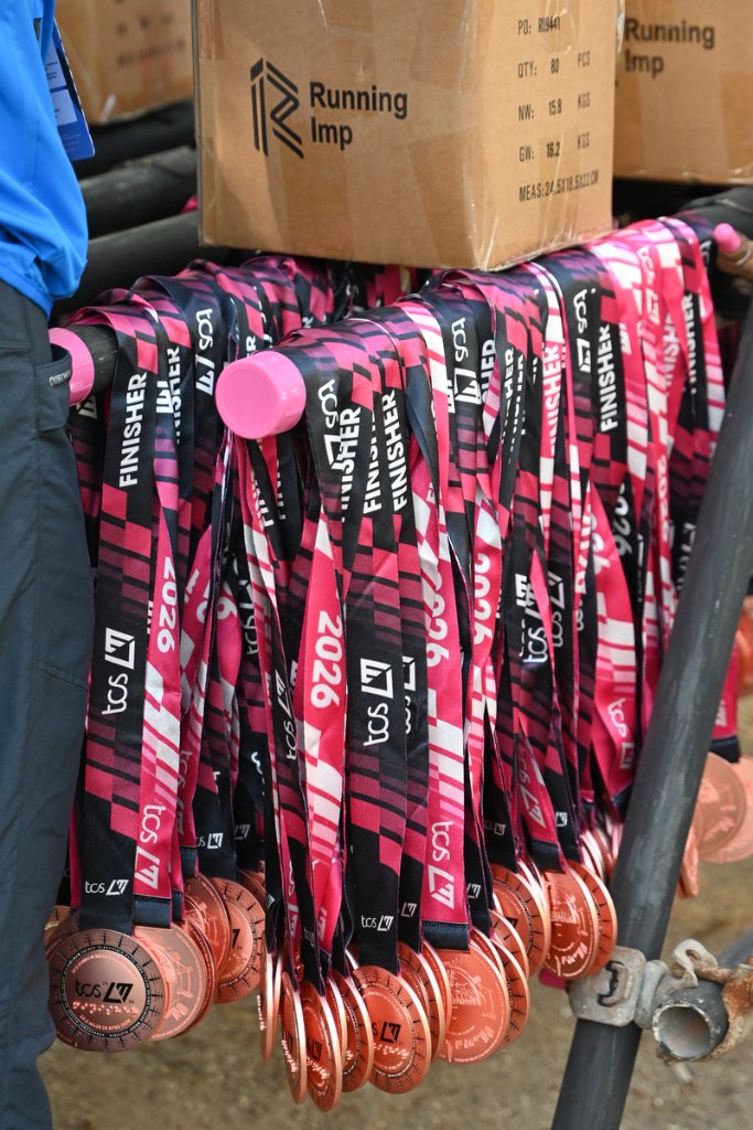 Rows of TCS London Marathon 2026 finisher medals on display