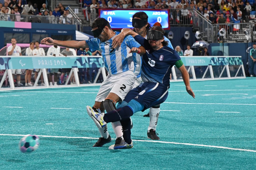 Argentina and France players battle for the ball during blind football gold medal match at Paris 2024