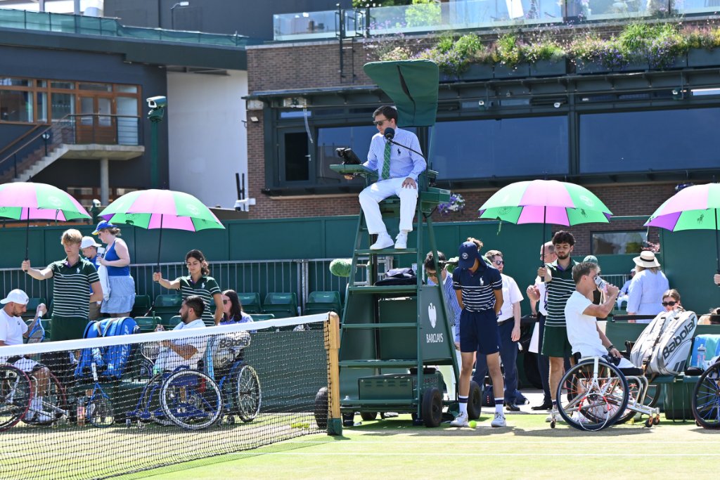 Chair umpire overlooking wheelchair tennis court at Wimbledon 2025