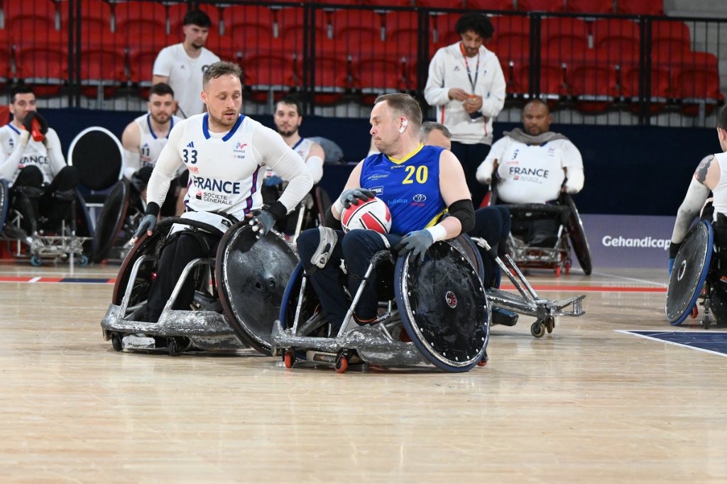 France No.33 challenging Sweden No.20 for possession