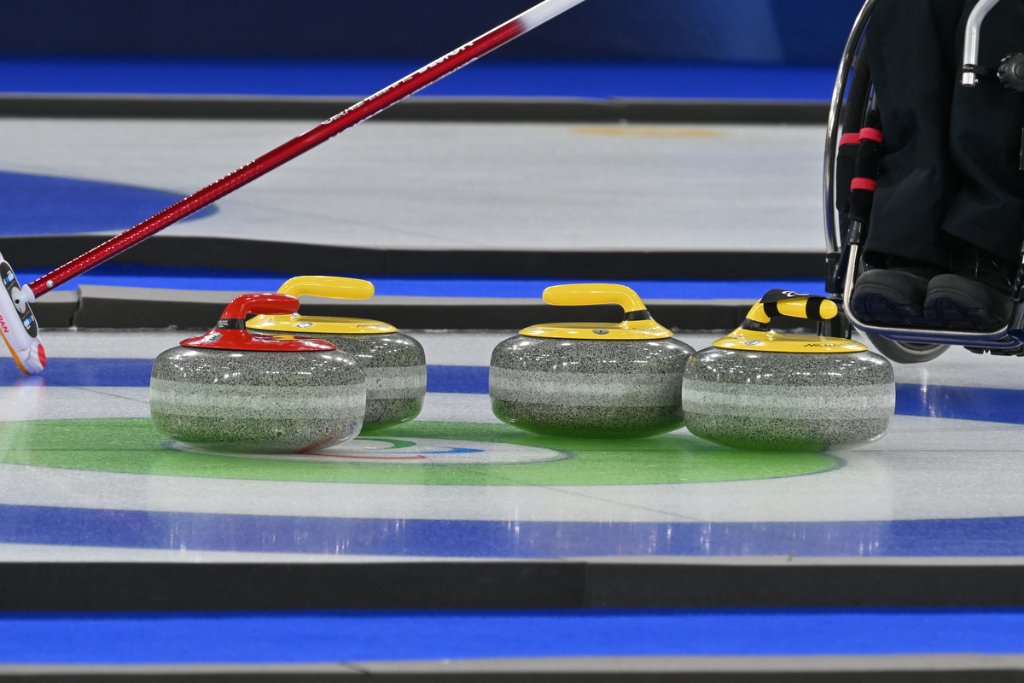 Curling stone in motion on the ice at Milano Cortina 2026 Winter Paralympics wheelchair curling