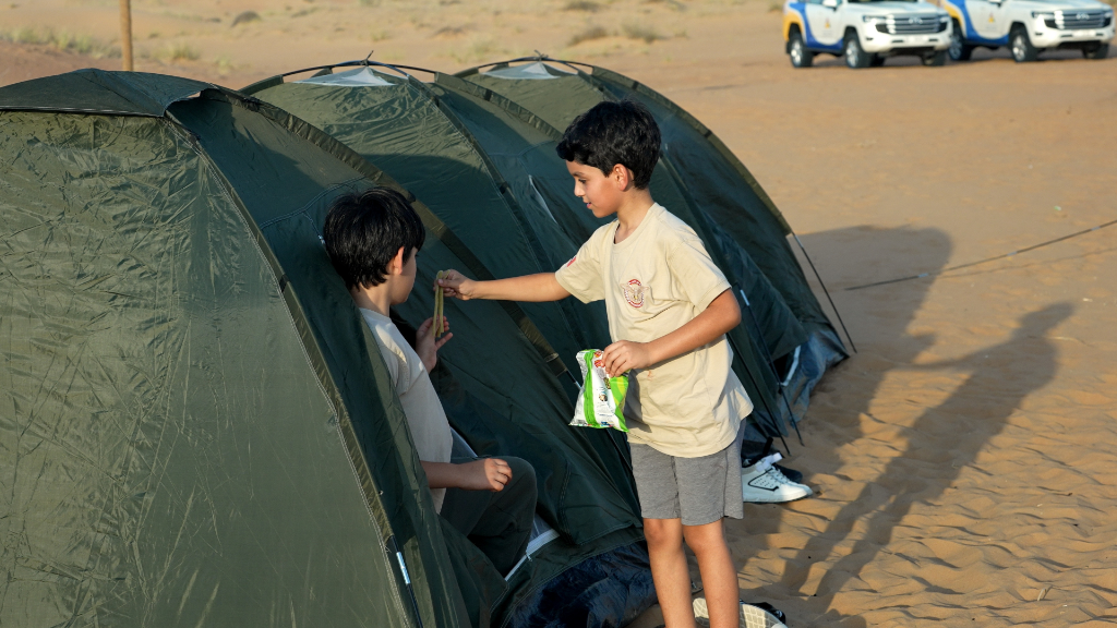 Instructor mentoring students outdoors