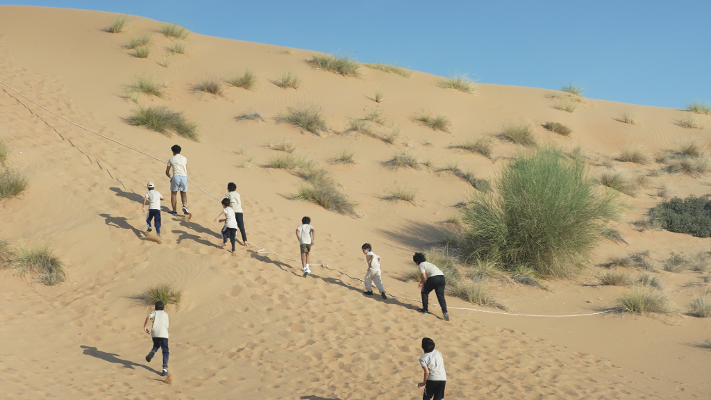 Students hiking in UAE mountains