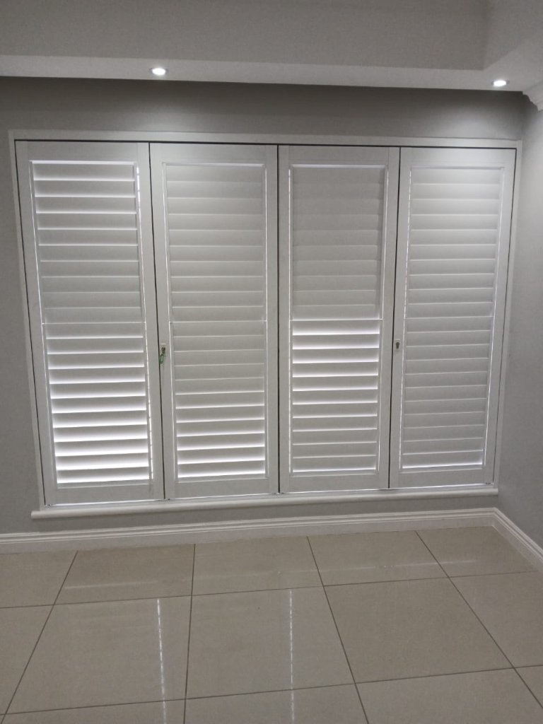 Closed white security shutters for privacy and light control by EasyBlinds Cape Town custom window blinds specialists