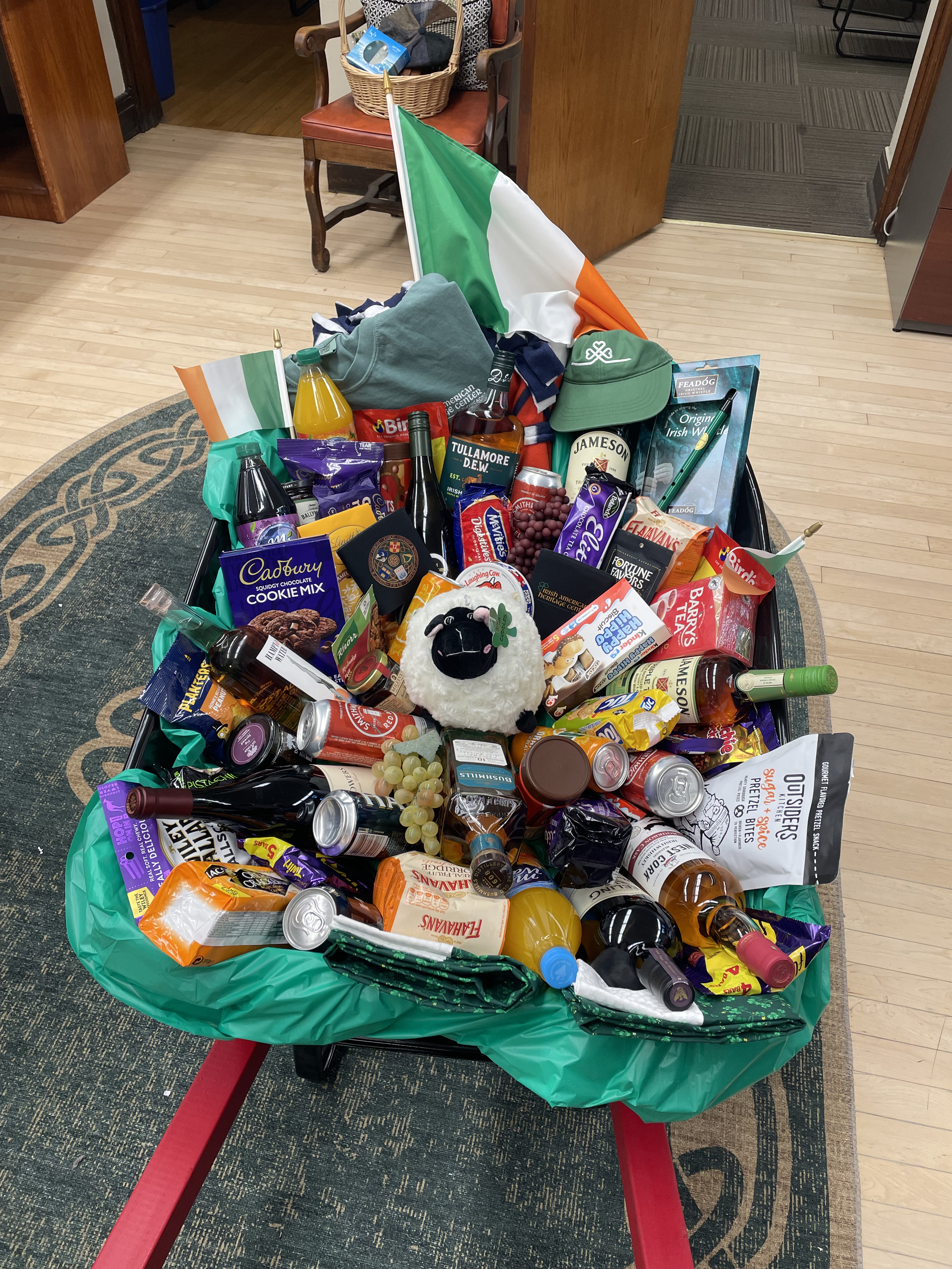 Grand Prize wheelbarrow contents — Irish whiskey, tea, treats, and gifts