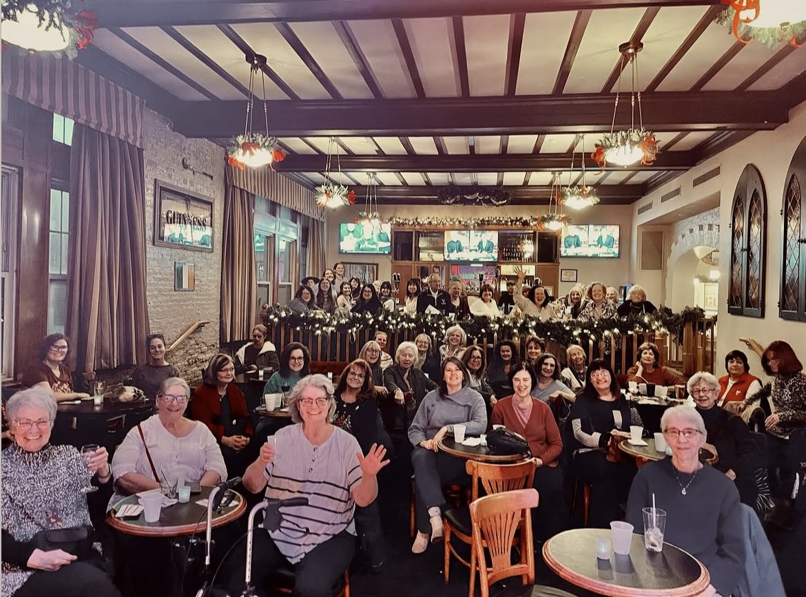 Women gathered at tables in the Fifth Province Pub for last year's Women's Christmas celebration