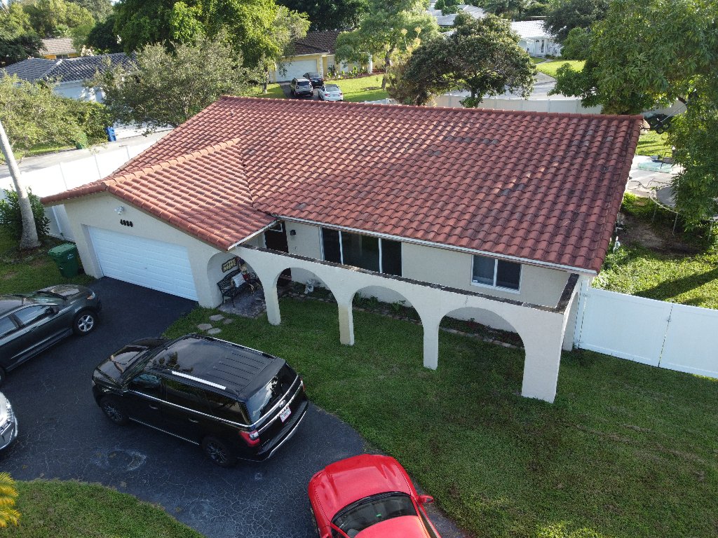 Aerial view of terracotta clay tile roof replacement completed on a South Florida residence