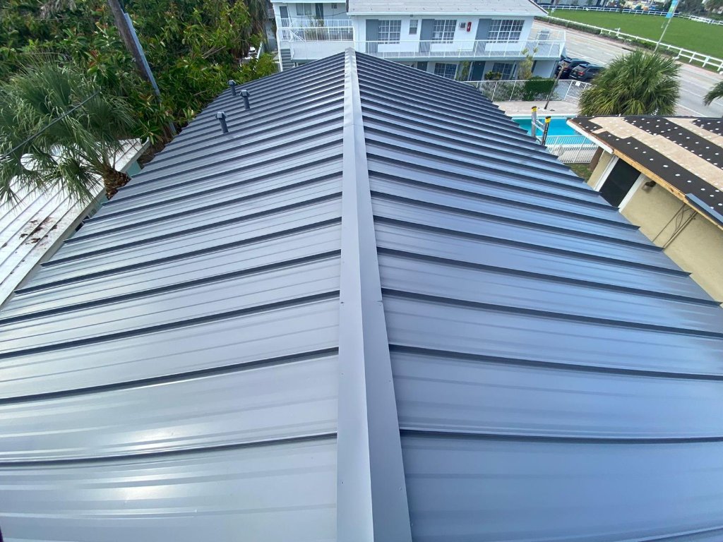 Dark charcoal standing seam metal roof replacement completed in Broward County FL