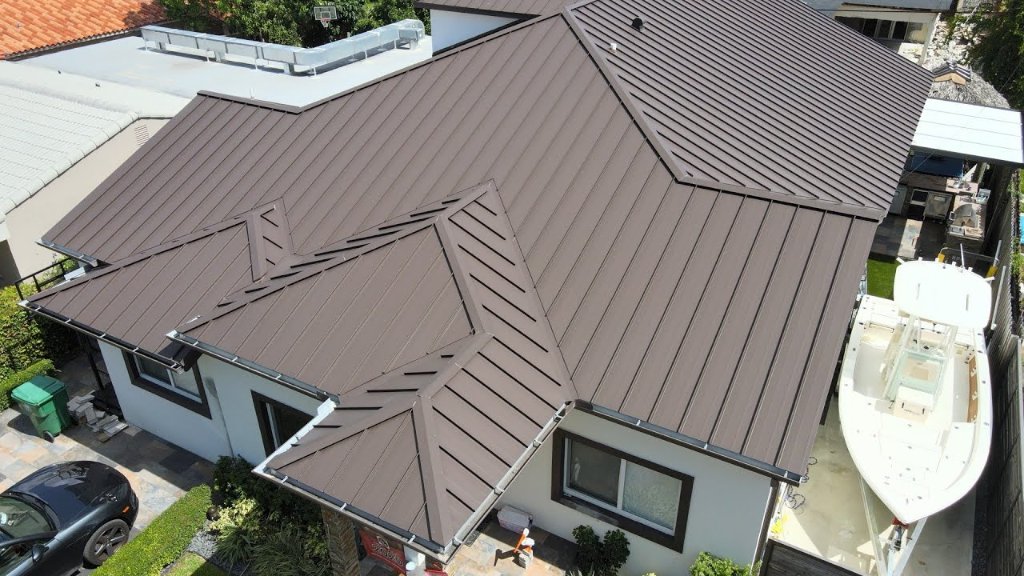 Drone photo of dark brown standing seam metal roof replacement on a South Florida residence