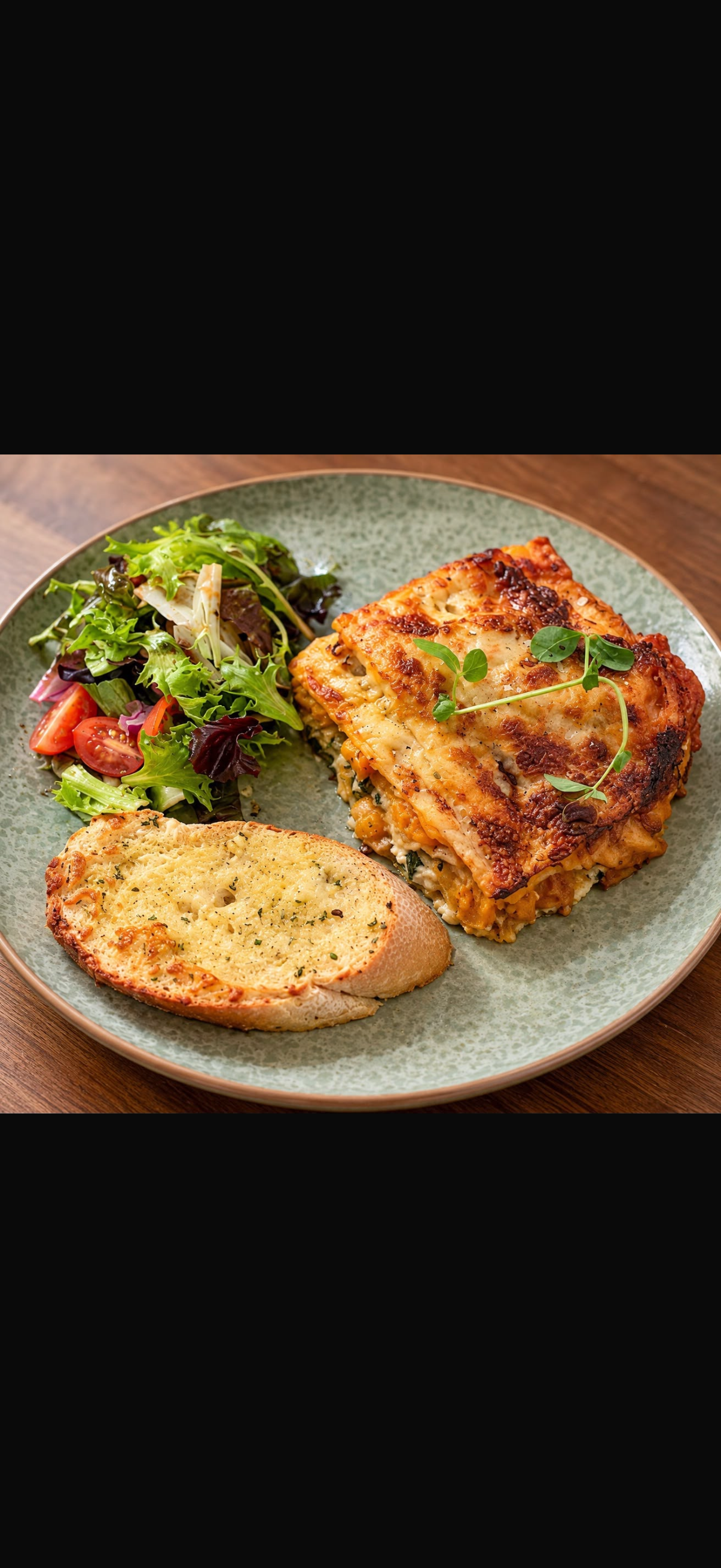 Vegetable bake with salad and garlic bread