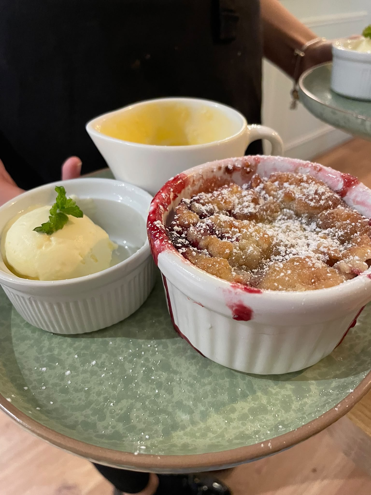 Warm apple and blackberry crumble with ice cream