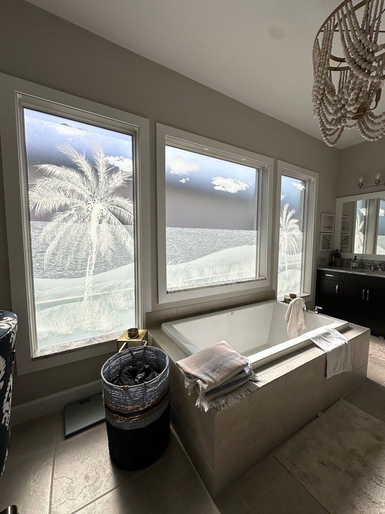 Palm artwork across bathroom windows
