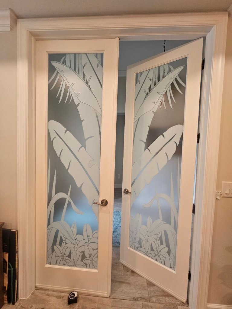 Tropical bird artwork on frosted double entry doors
