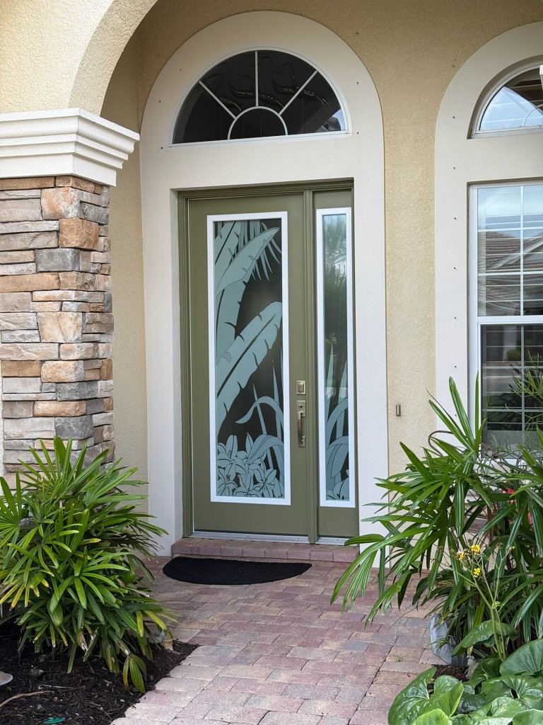 Tropical decorative artwork on a single exterior entry door