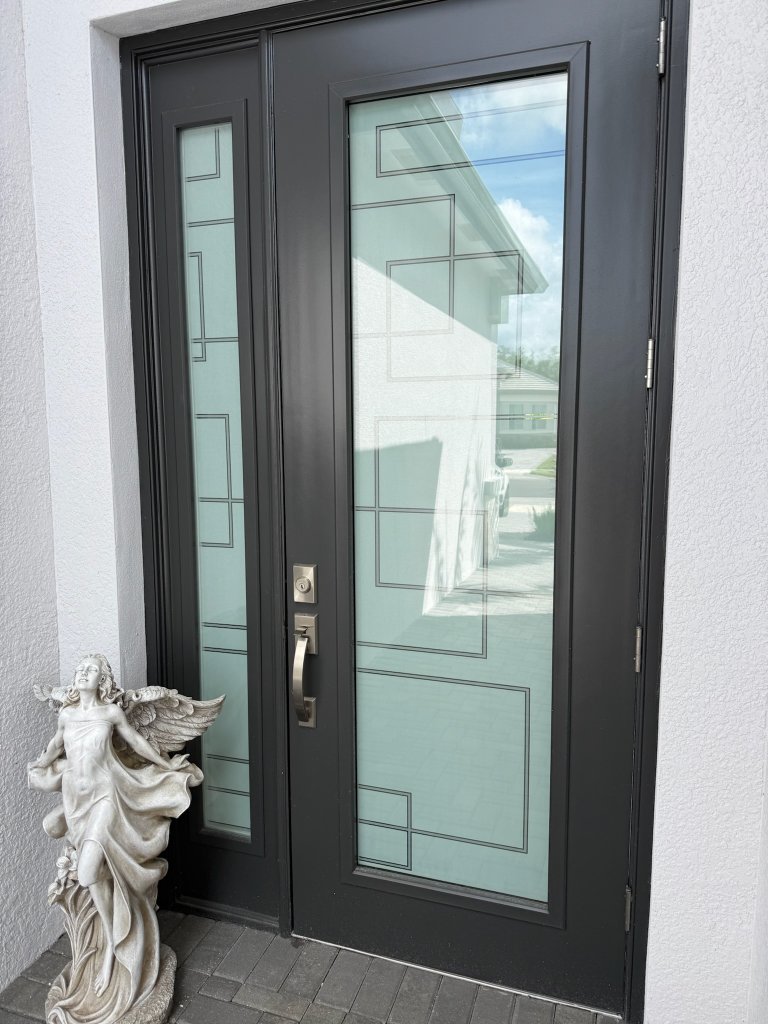 Rectangular linework on black-framed double entry doors