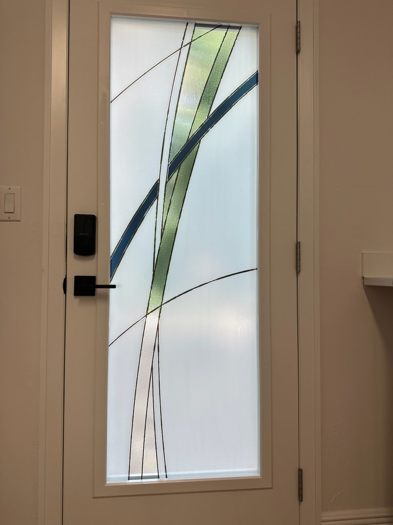 Blue and dark sweeping accents on a single entry door