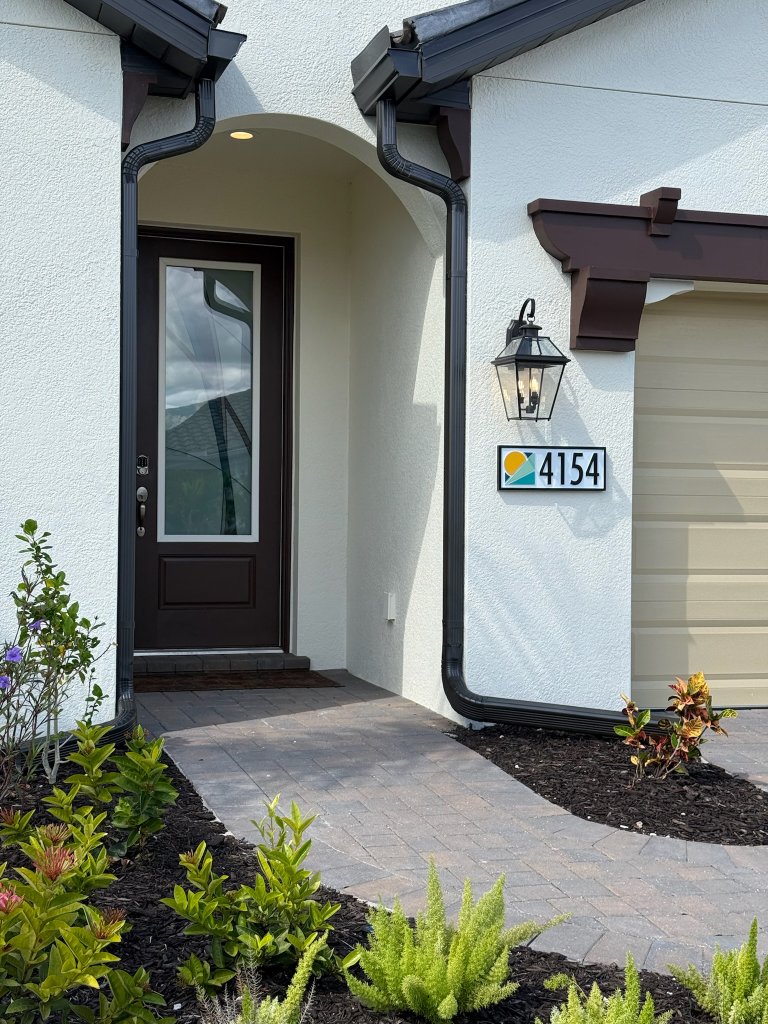 Frosted decorative film on an exterior entry door and sidelight