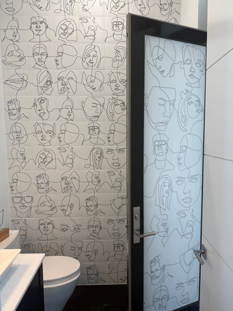 Floral linework on an interior glass privacy panel