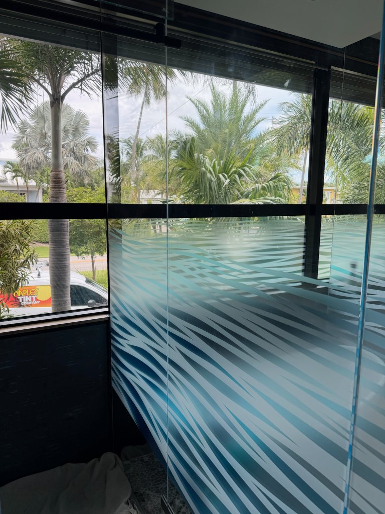 Horizontal decorative bands across a glass corner