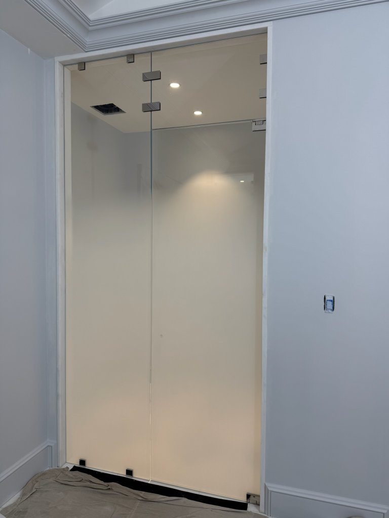 Frosted glass enclosure with a clear upper band