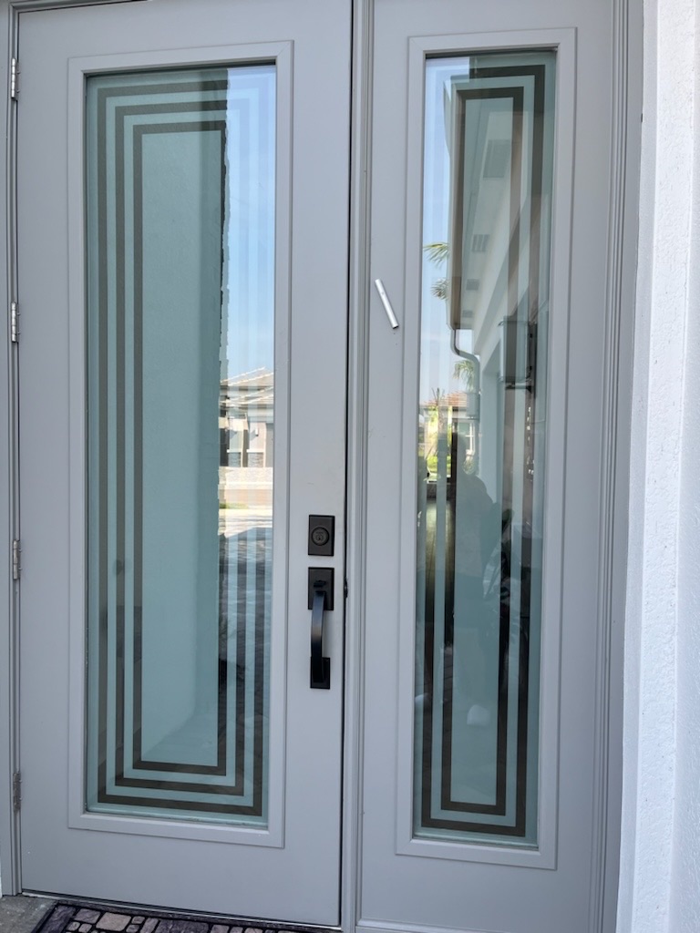 Rectangular clear borders on white-framed double entry doors