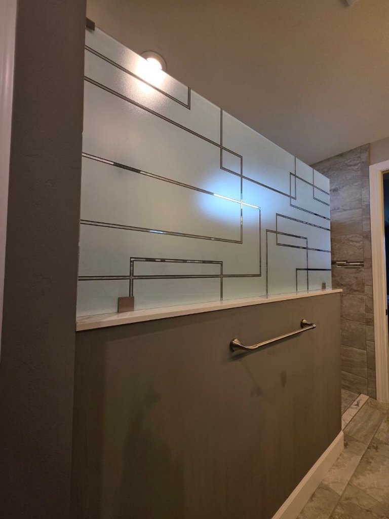 Rectangular clear linework above a frosted shower band