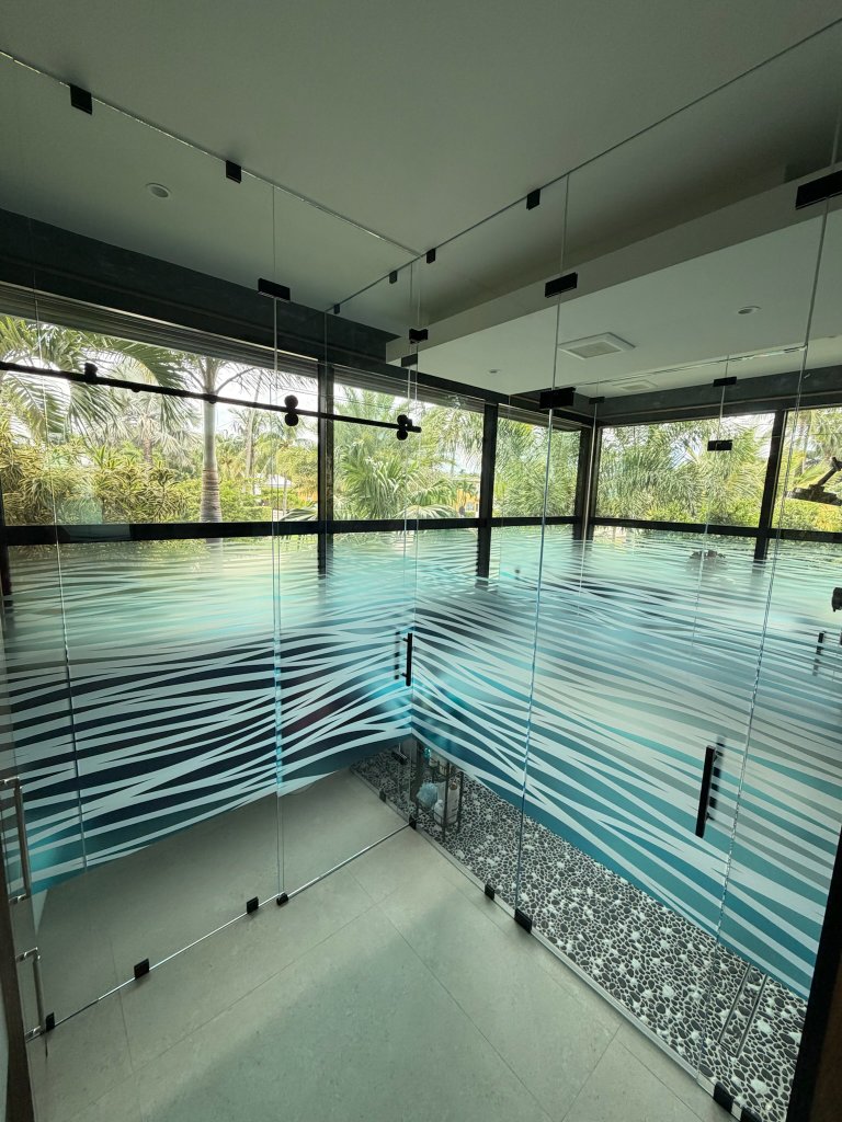 Layered horizontal bands on glass doors and surrounding panes