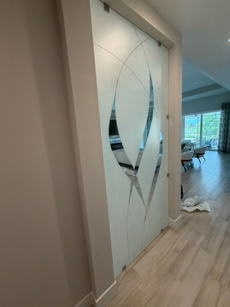 Bold curved accents on interior frosted glass doors