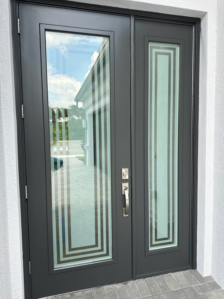 Nested rectangular linework on gray-framed double entry doors