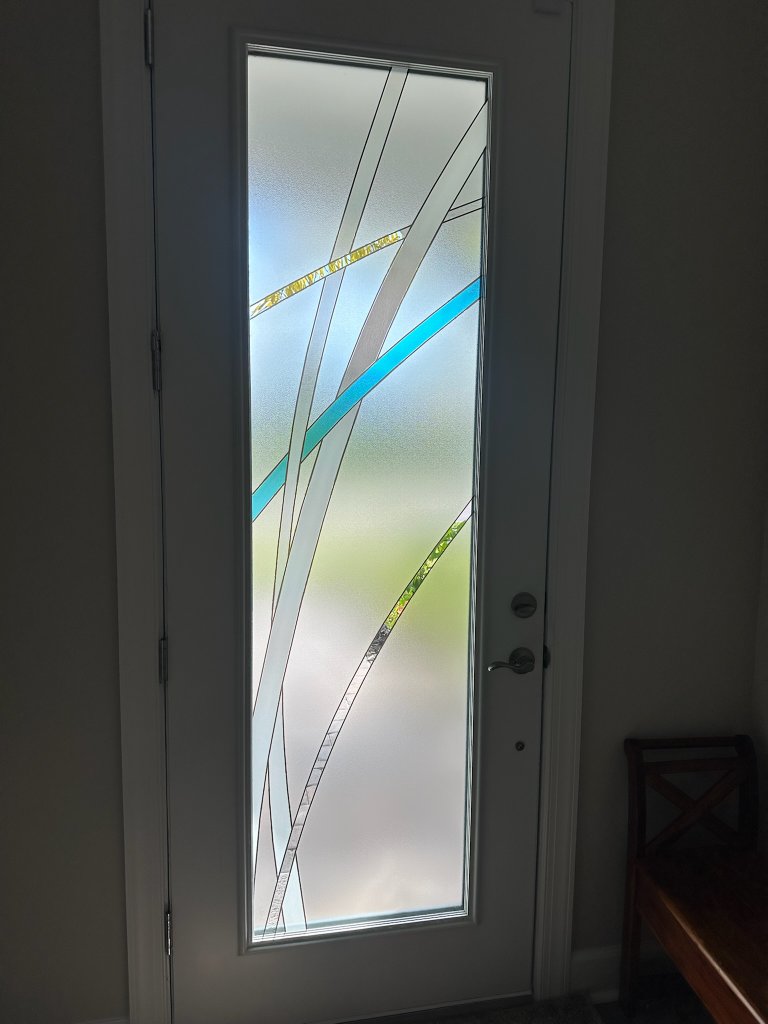 Blue and clear angular accents on frosted entry-door glass