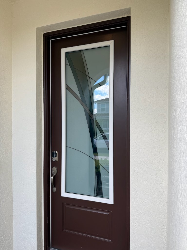 Sweeping dark accent on a wood-framed entry door