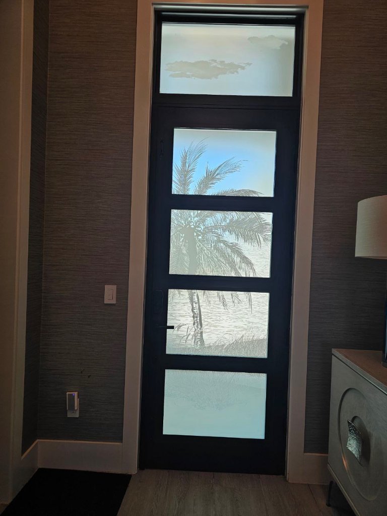 Palm motif across rectangular entry-door glass panes