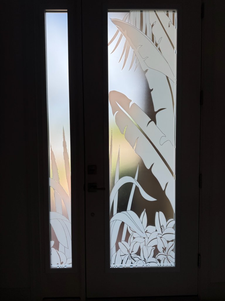 Tropical bird and foliage artwork on a narrow entry door