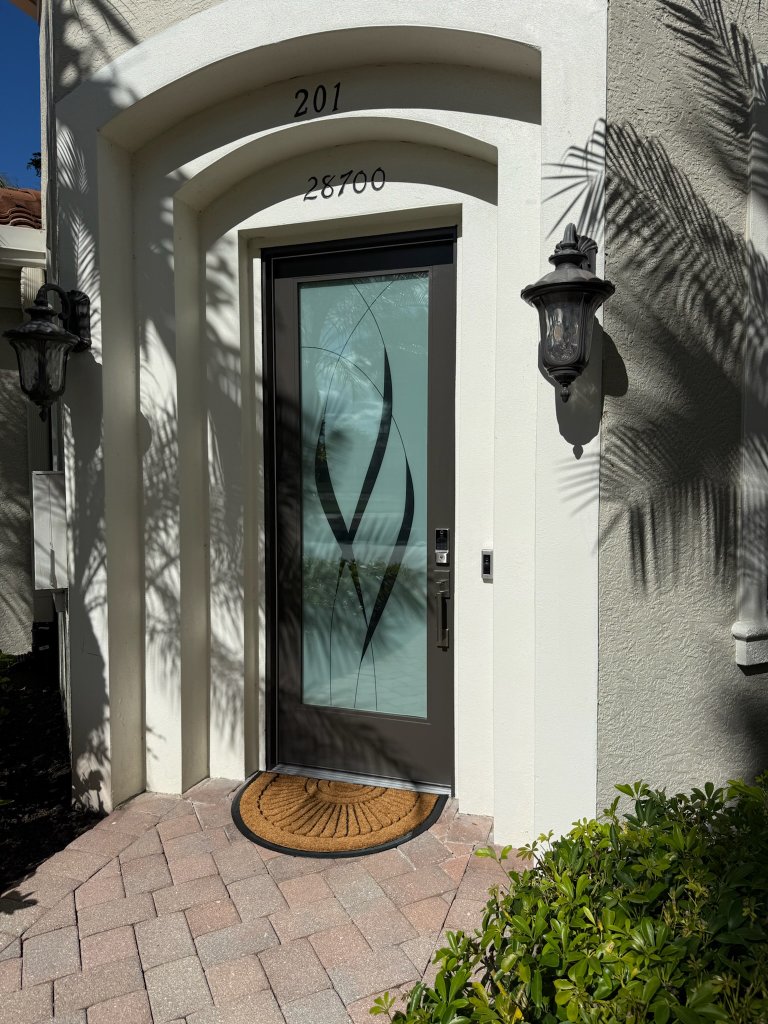 Curved frosted design on a single exterior entry door