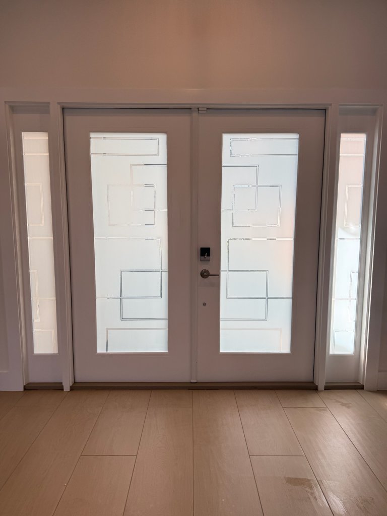 Rectangular clear linework on frosted entry doors and sidelights