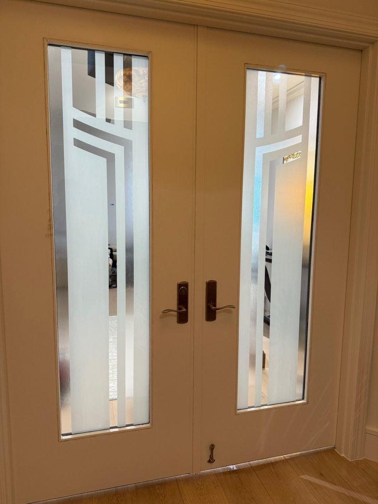 Geometric clear border detail on double entry doors