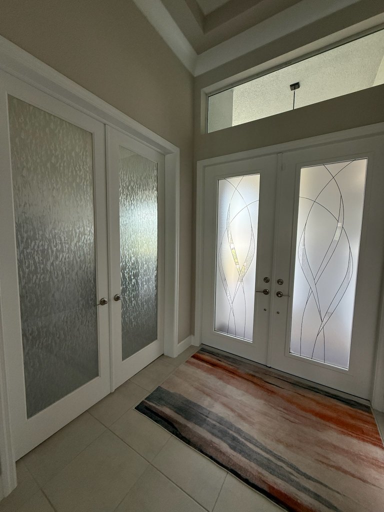 Custom decorative window film installed on residential glass