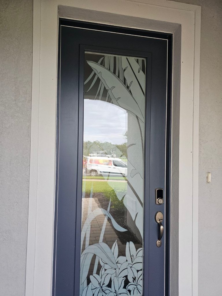 Tropical bird artwork on a narrow entry-door pane