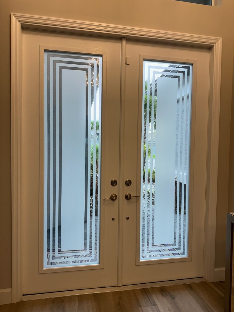 Nested rectangular border design on double entry doors